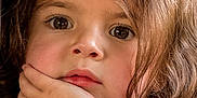 Everleigh is registered to the contest to win money with this photo: toddler, child, face, hand, brown_hair, curious, close_up, portrait, expression, young_child, skin, eyelashes, clothing, patterned_shirt, indoor, resting, cute, person, young_face, soft_light