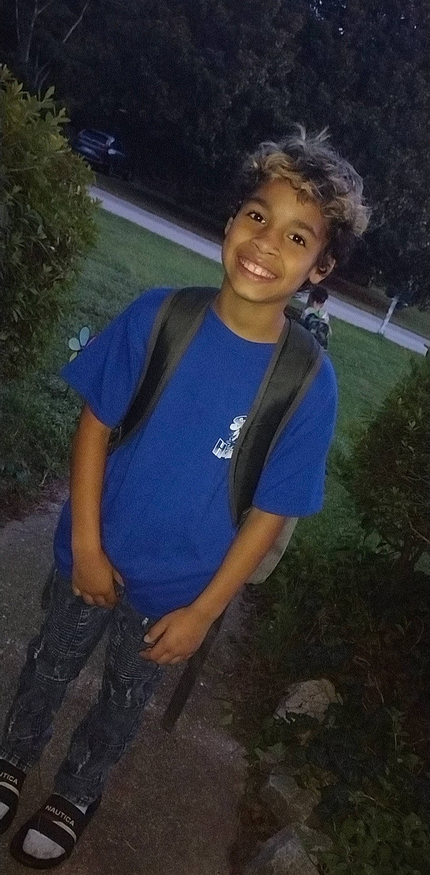 Javion is registered to the contest to win money with this photo: bag, denim, electric_blue, flash_photography, fun, grass, happy, joy, leisure, luggage_and_bags, midnight, night, person, plant, rock, smile, soil, t_shirt, tree