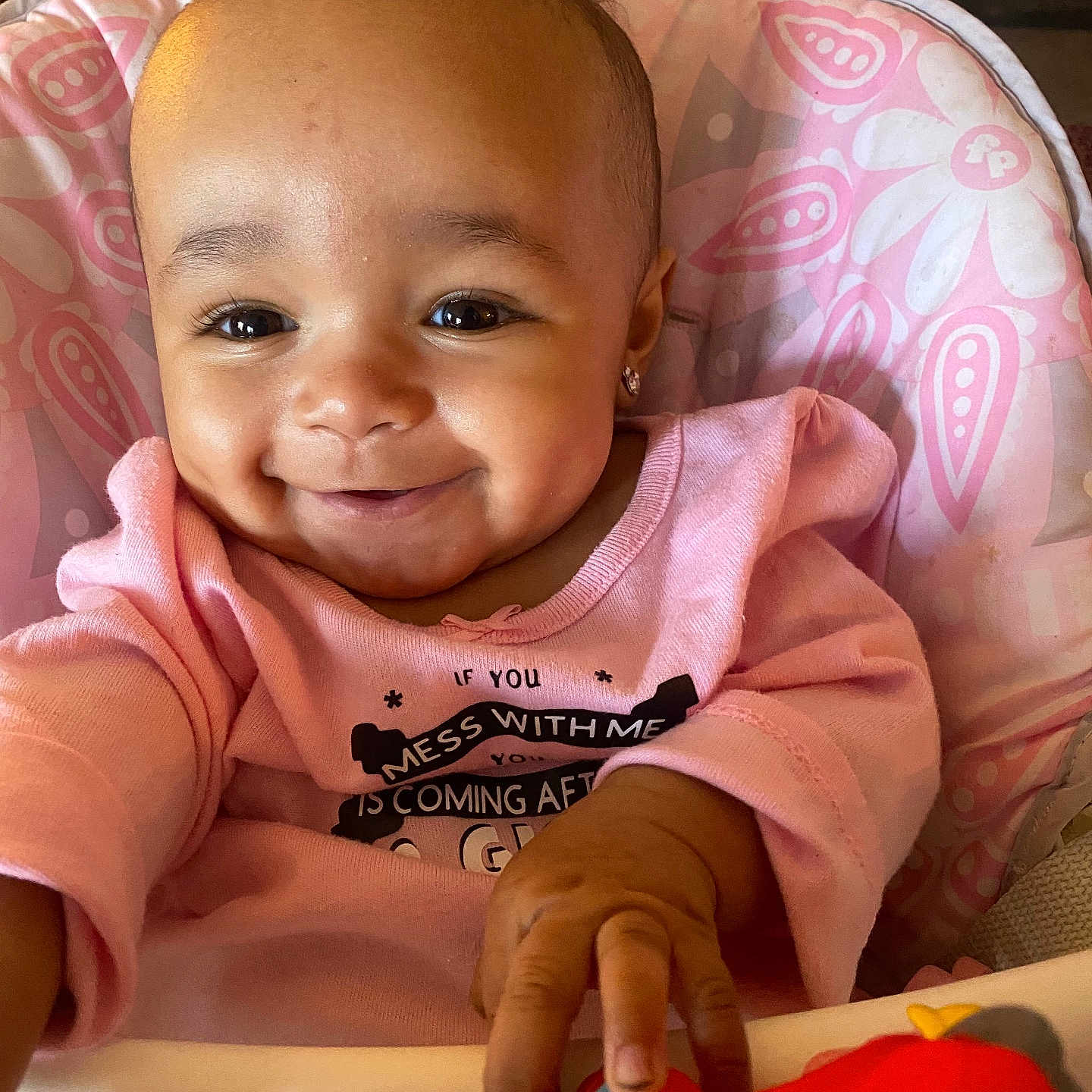 Ryder is registered to the contest to win money with this photo: accessories, baby, bodypart, chair, clothing, couch, cushion, face, finger, furniture, hand, happy, head, homedecor, person, photography, portrait, sitting, smile, t_shirt