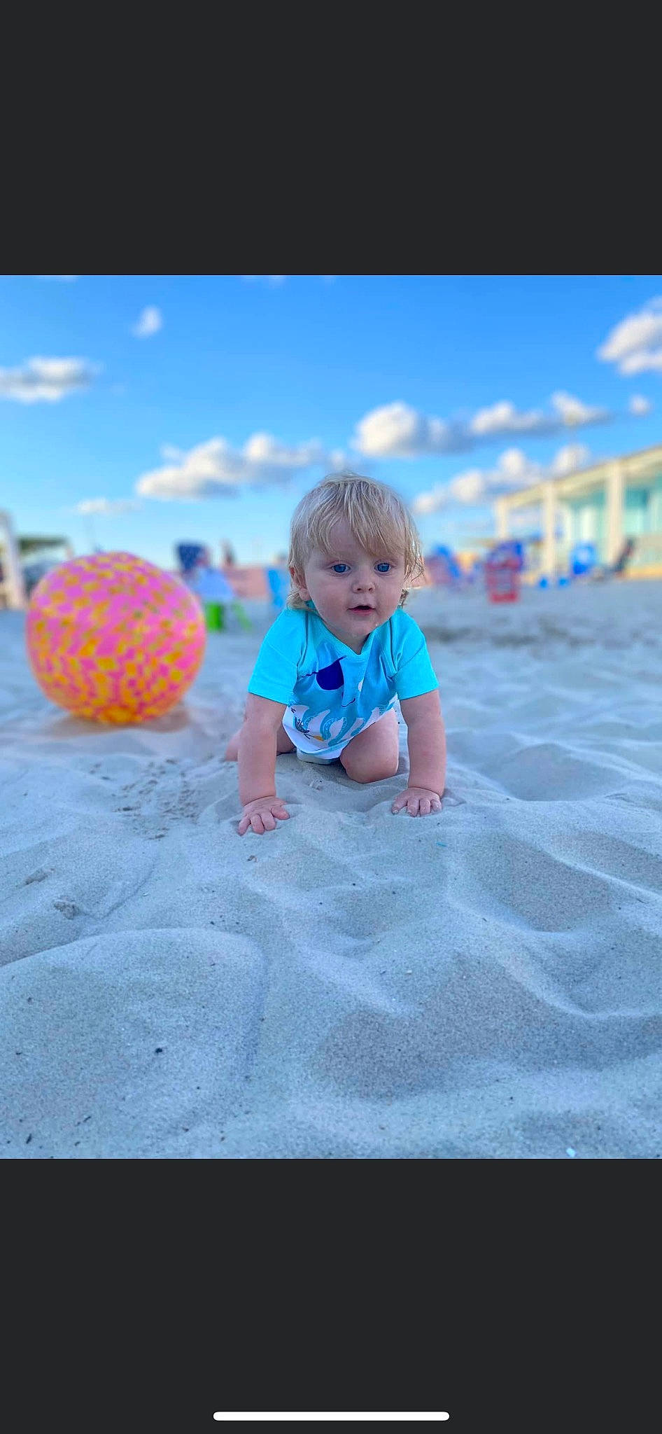 Julian is registered to the contest to win money with this photo: aqua, asphalt, azure, baby, baby_toddler_clothing, child, cloud, electric_blue, flooring, fun, grass, happy, leisure, person, pink, product, recreation, sky, surprise, t_shirt