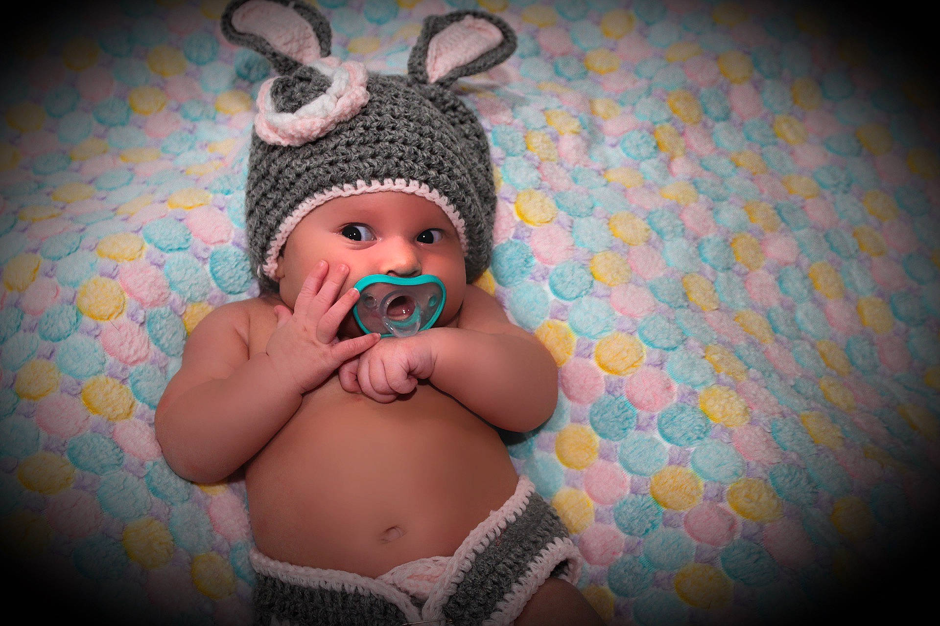 Guinevere is registered to the contest to win money with this photo: baby, baby_toddler_clothing, cap, child, costume_hat, fashion_accessory, finger, flash_photography, fun, happy, headband, headgear, headpiece, headwear, jewellery, magenta, organ, pattern, person, pink