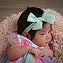 Dalzary is registered to the contest to win money with this photo: baby, bow, child, closeup, clothing, cushion, cute, face, fluffy, hair, hand, headband, indoor, infant, newborn, pastel_colors, pink, portrait, skin, soft_texture