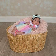 Dalzary is registered to the contest to win money with this photo: baby, background, basket, child, cozy, cushion, dress, floor, headband, headwear, indoor, infant, newborn, pastel_colors, pink, portrait, relaxing, soft_texture, wooden_floor, woven_basket