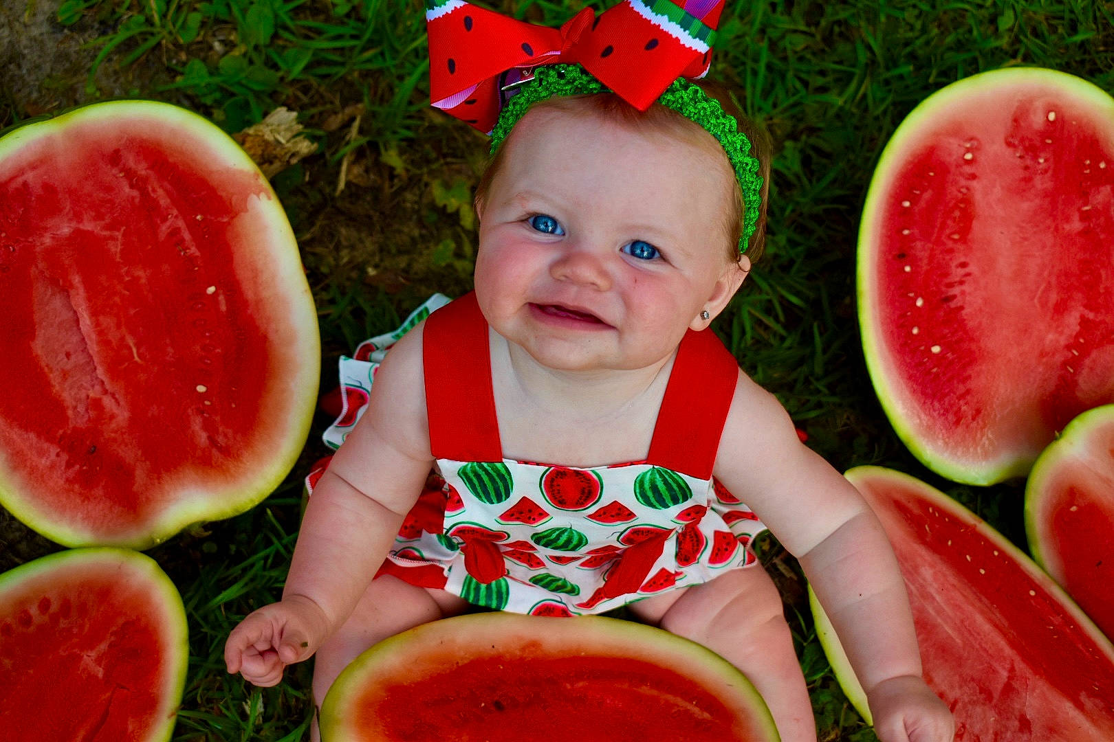 Everleigh Kate is registered to the contest to win money with this photo: baby_toddler_clothing, citrullus, dress, facial_expression, food, fruit, green, happy, joy, melon, natural_foods, orange, people_in_nature, person, photograph, pink, red, sharing, skin, smile