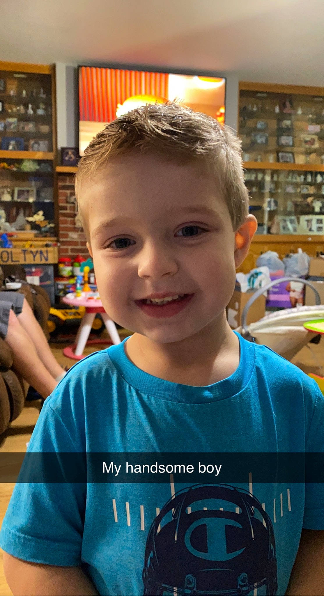 Coltyn is registered to the contest to win money with this photo: bag, beauty, child, electric_blue, fun, hairstyle, happy, joy, leisure, luggage_and_bags, person, photograph, play, product, retail, room, shelf, sleeve, smile, snapshot