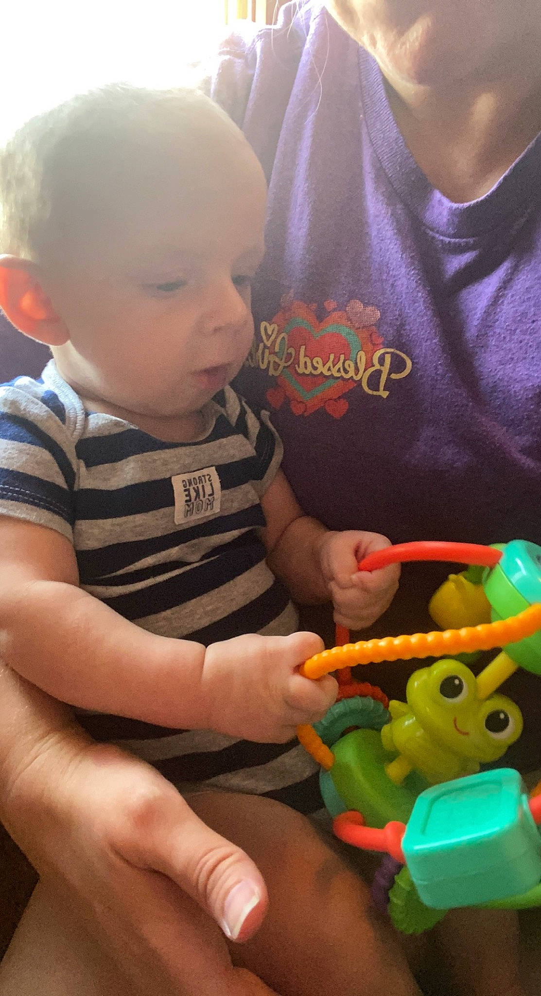 Brogan joined the competition — help win amazing prizes! baby, baby_playing_with_toys, baby_toddler_clothing, child, finger, fun, green, hand, happy, head, person, play, sleeve, snapshot, stuffed_toy, t_shirt, thumb, toddler, toy, toy_vehicle