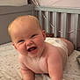 baby, smiling, crawling, crib, diaper, infant, cute, happy, child, bed, mattress, stars, moons, nursery, furniture, person, skin, head, arm, cheeks