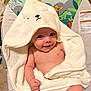 animal_print, baby, baby_bouncer, bear, bird, blanket, child, cozy, cute, giraffe, happy, hood, indoor, infant, skin, sloth, smile, soft, towel, wrapped