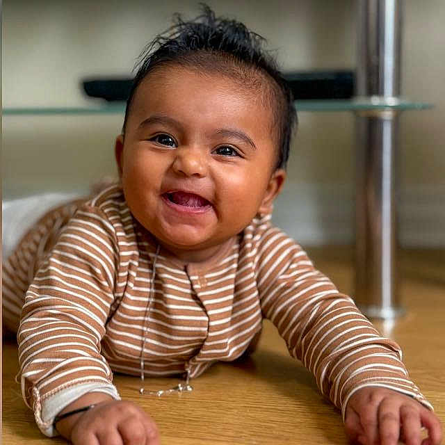 Elenora joined the competition — help win amazing prizes! baby, bright_eyes, child, cute, expression, eyebrows, face, floor, hand, happy, indoors, lying_down, mouth, person, portrait, skin, smiling, striped_clothing, toddler, young_child