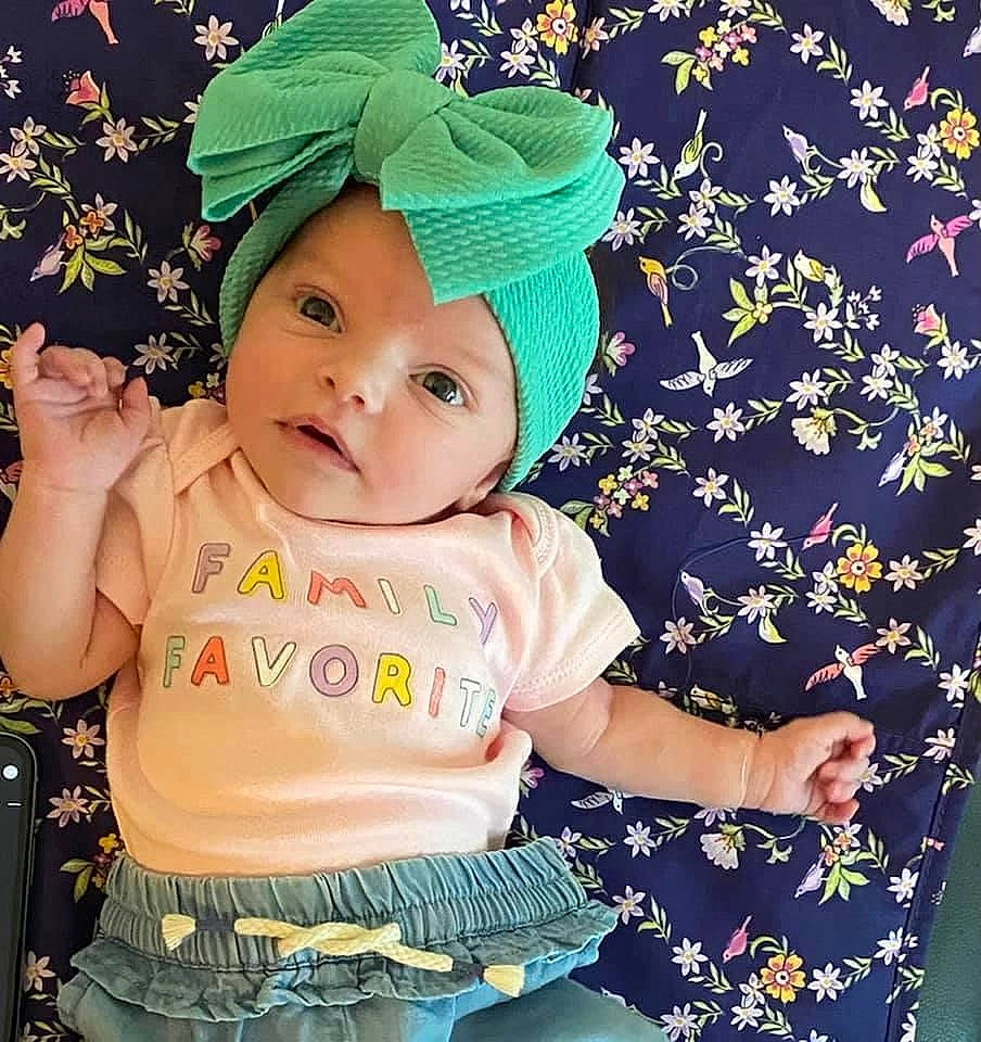 Sawyer is registered to the contest to win money with this photo: baby, baby_products, baby_sleeping, baby_toddler_clothing, cap, child, cool, costume_hat, fashion_accessory, font, happy, headgear, headwear, pattern, people_in_nature, person, pink, product, sleeve, t_shirt