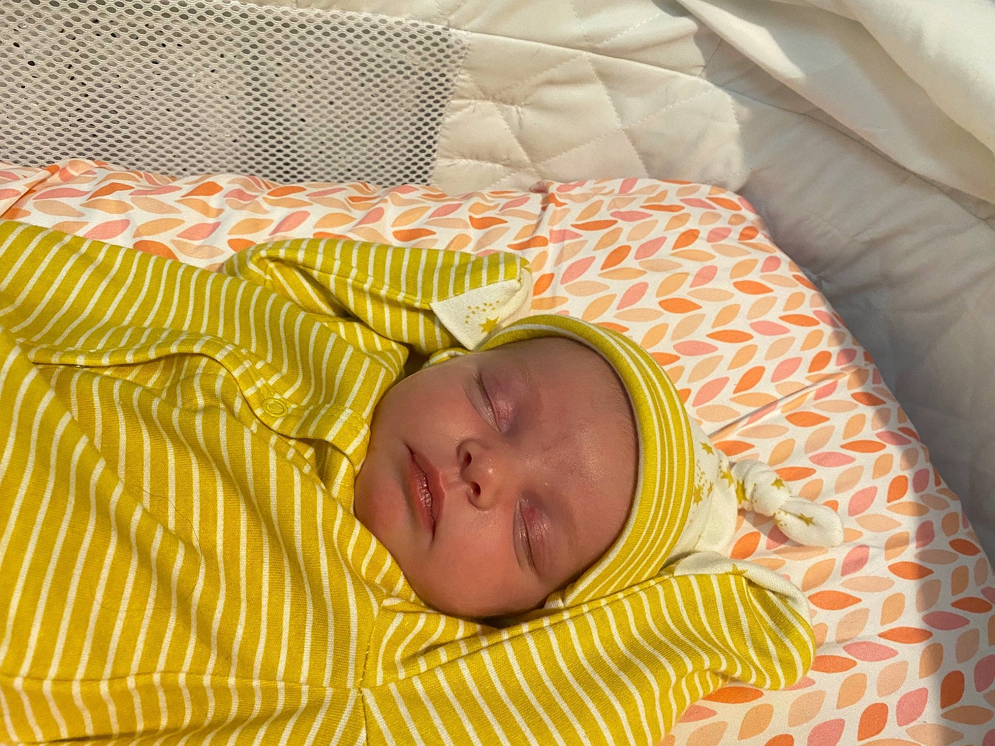 Sawyer joined the competition — help win amazing prizes! baby, baby_products, baby_safety, baby_sleeping, baby_toddler_clothing, bed, bed_sheet, bedding, bedtime, cheek, child, comfort, eye, face, head, linens, orange, pattern, person, textile