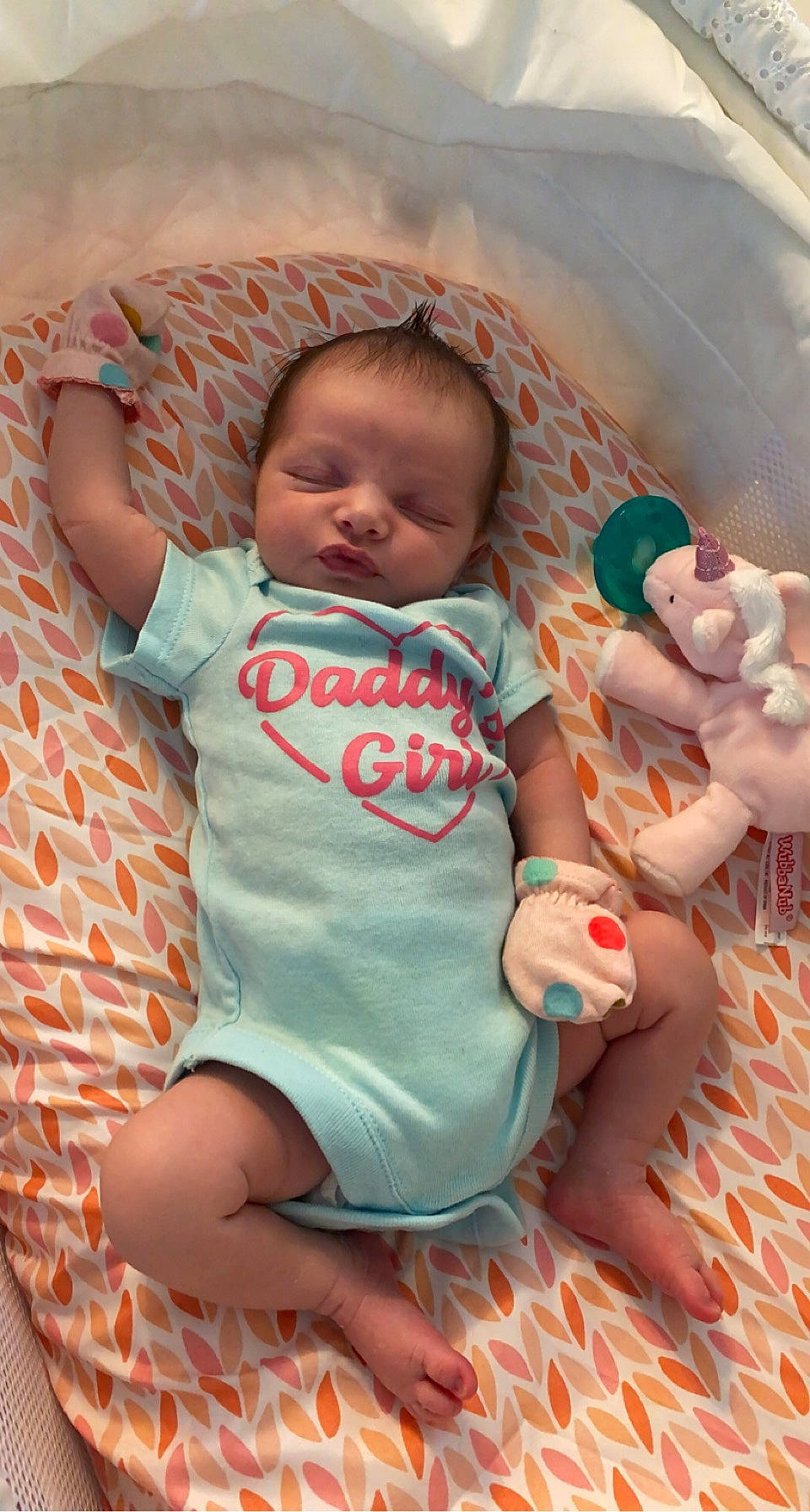 Sawyer is registered to the contest to win money with this photo: baby, baby_products, baby_toddler_clothing, cheek, child, comfort, facial_expression, finger, fun, happy, head, human_body, linens, mouth, person, pink, skin, sleeve, textile, thumb