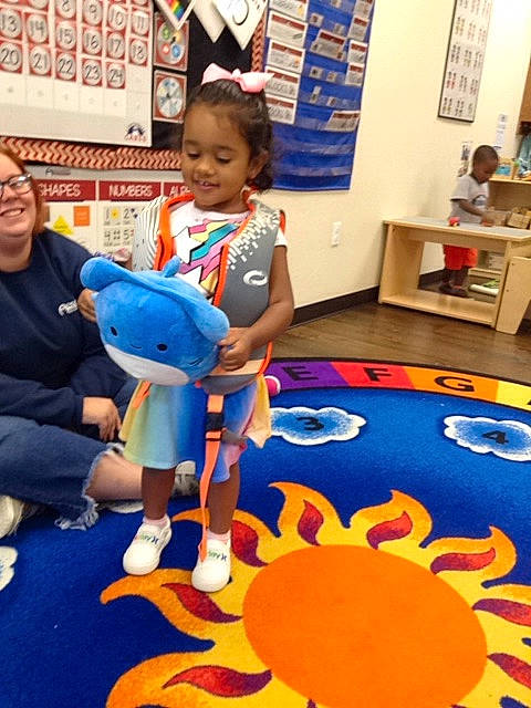 Kayleigh is registered to the contest to win money with this photo: art, blue, child, electric_blue, event, flooring, fun, joy, kindergarten, leisure, party_supply, pattern, person, picture_frame, play, recreation, room, smile, t_shirt, toddler