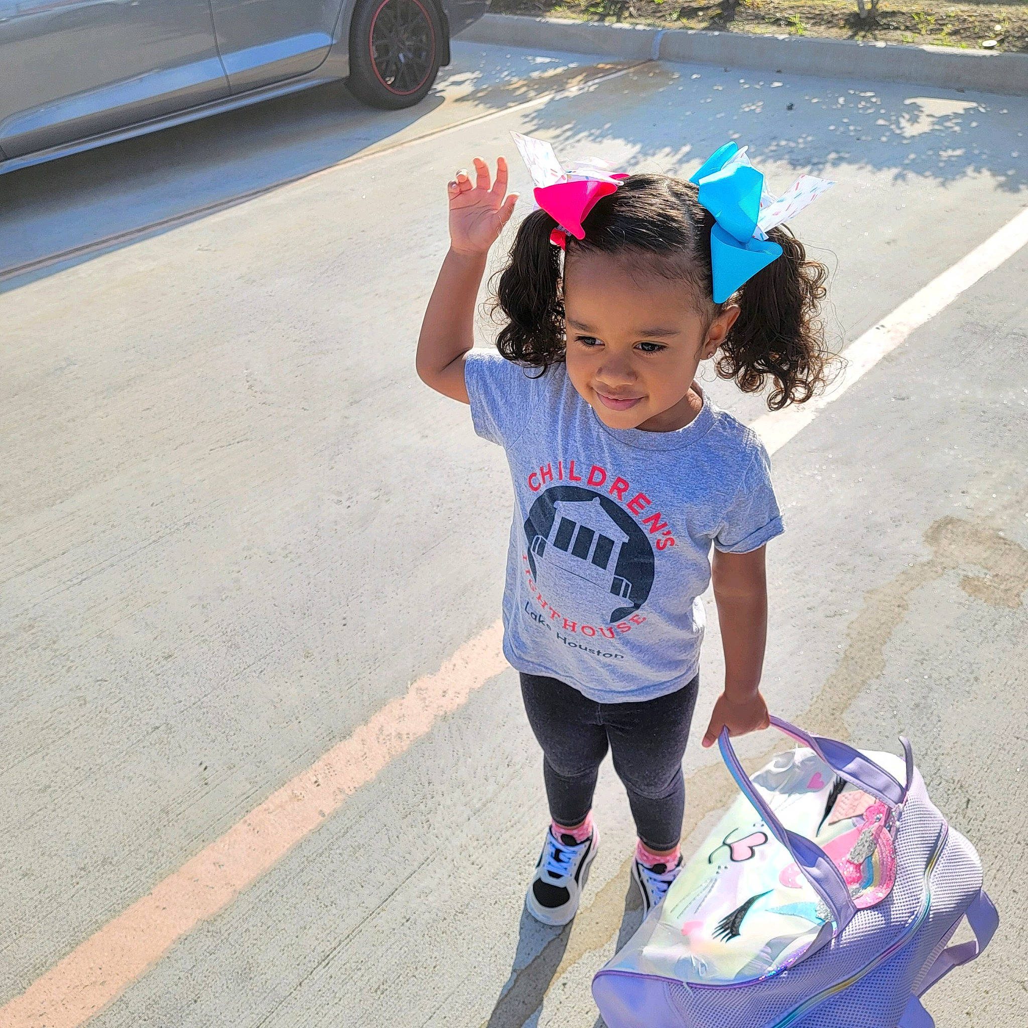 Kayleigh joined the competition — help win amazing prizes! asphalt, automotive_design, automotive_tire, beauty, car, cool, electric_blue, hair, hairstyle, happy, joy, leisure, motor_vehicle, person, pink, sleeve, t_shirt, tire, toddler, vehicle_door