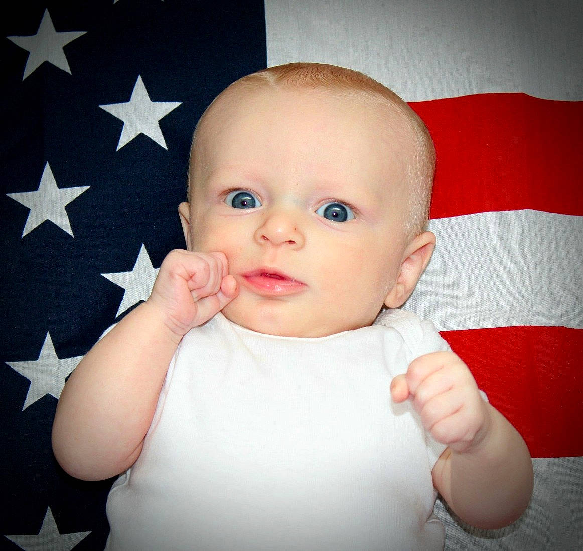 Séamus is registered to the contest to win money with this photo: boy, cheek, child, chin, ear, eye, face, finger, forehead, girl, hand, head, infant, lip, mouth, nose, person, skin, smile, thumb