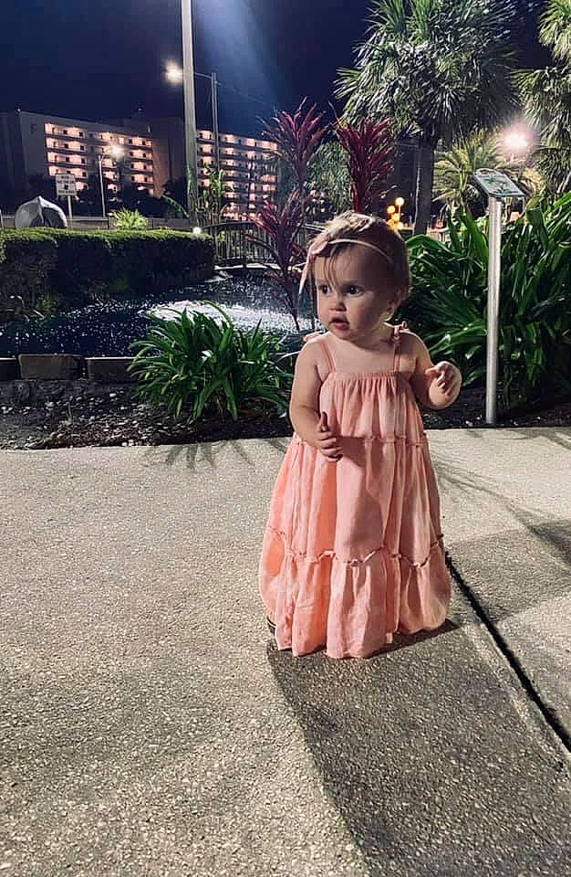 Dylan is registered to the contest to win money with this photo: asphalt, dress, flash_photography, flooring, formal_wear, gown, grass, happy, leisure, lighting, people_in_nature, person, plant, road, road_surface, sidewalk, street_fashion, street_light, tints_and_shades, toddler