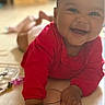 Aline participe au concours pour gagner de l'argent avec cette photo : baby, child, smiling, red_clothing, indoor, tummy_time, happy, face, hands, person, infant, cute, portrait, young_child, skin, bright, soft_light, closeup, floor, toy