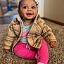 child, clothing, coat, face, female, girl, happy, hardwood, head, hosiery, jacket, knitwear, pants, person, photography, portrait, sitting, smile, sock, sweater