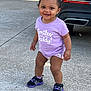 child, city, clothing, face, female, footwear, girl, head, machine, pants, person, photography, portrait, road, shoe, shorts, sneaker, street, t_shirt, urban