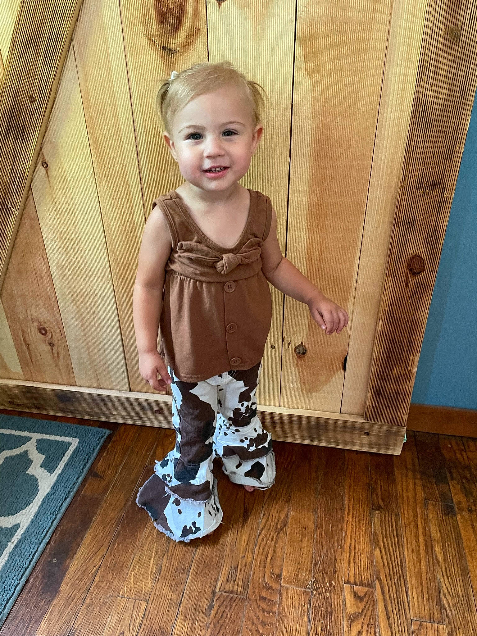 Lilliana joined the competition — help win amazing prizes! baby, baby_toddler_clothing, child, floor, flooring, happy, hardwood, joy, laminate_flooring, leg, pattern, person, purple, skin, sleeve, smile, t_shirt, toddler, varnish, wood