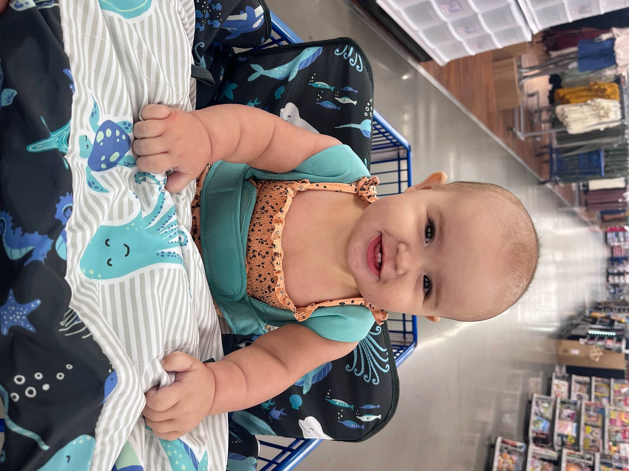 Addison is registered to the contest to win money with this photo: arm, baby, beauty, child, convenience_store, cool, fashion_accessory, fun, hairstyle, happy, hat, jewellery, joy, pattern, person, retail, room, shelf, shelving, smile