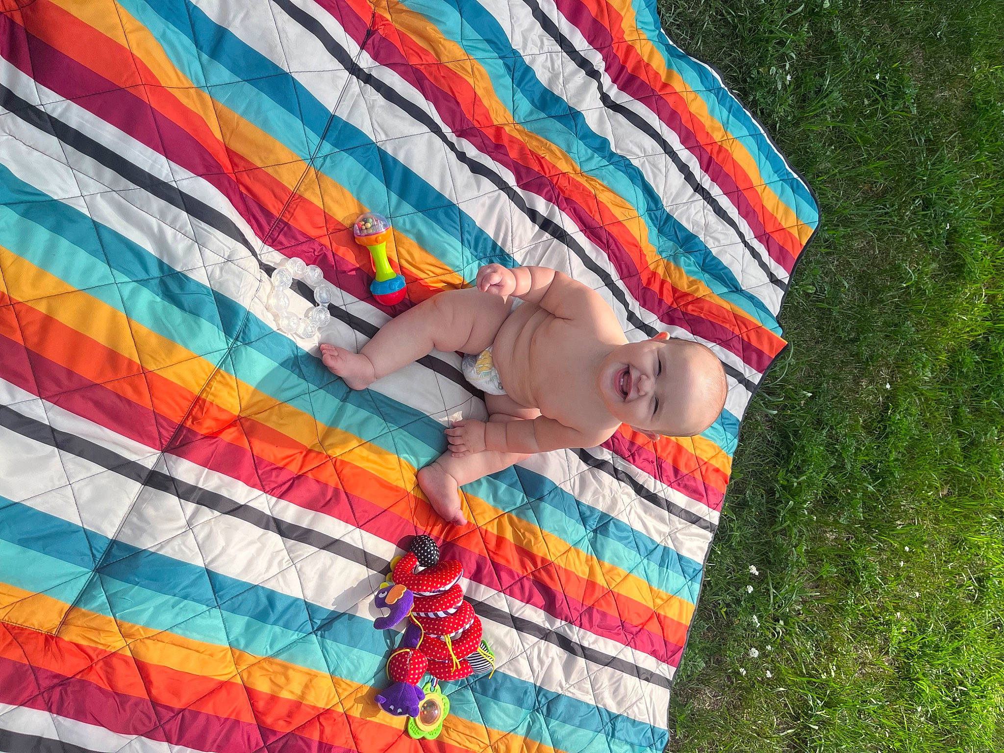 Addison is registered to the contest to win money with this photo: art, baby, child, fashion_accessory, fun, hand, happy, joy, leisure, linens, magenta, pattern, people_in_nature, person, play, recreation, smile, sunglasses, textile, toddler