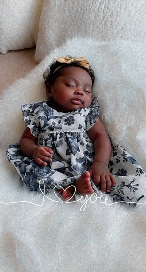 Milan is registered to the contest to win money with this photo: baby, baby_toddler_clothing, bedding, child, comfort, face, flash_photography, flooring, fun, grey, happy, linens, pattern, person, pink, room, sitting, skin, sleeve, textile