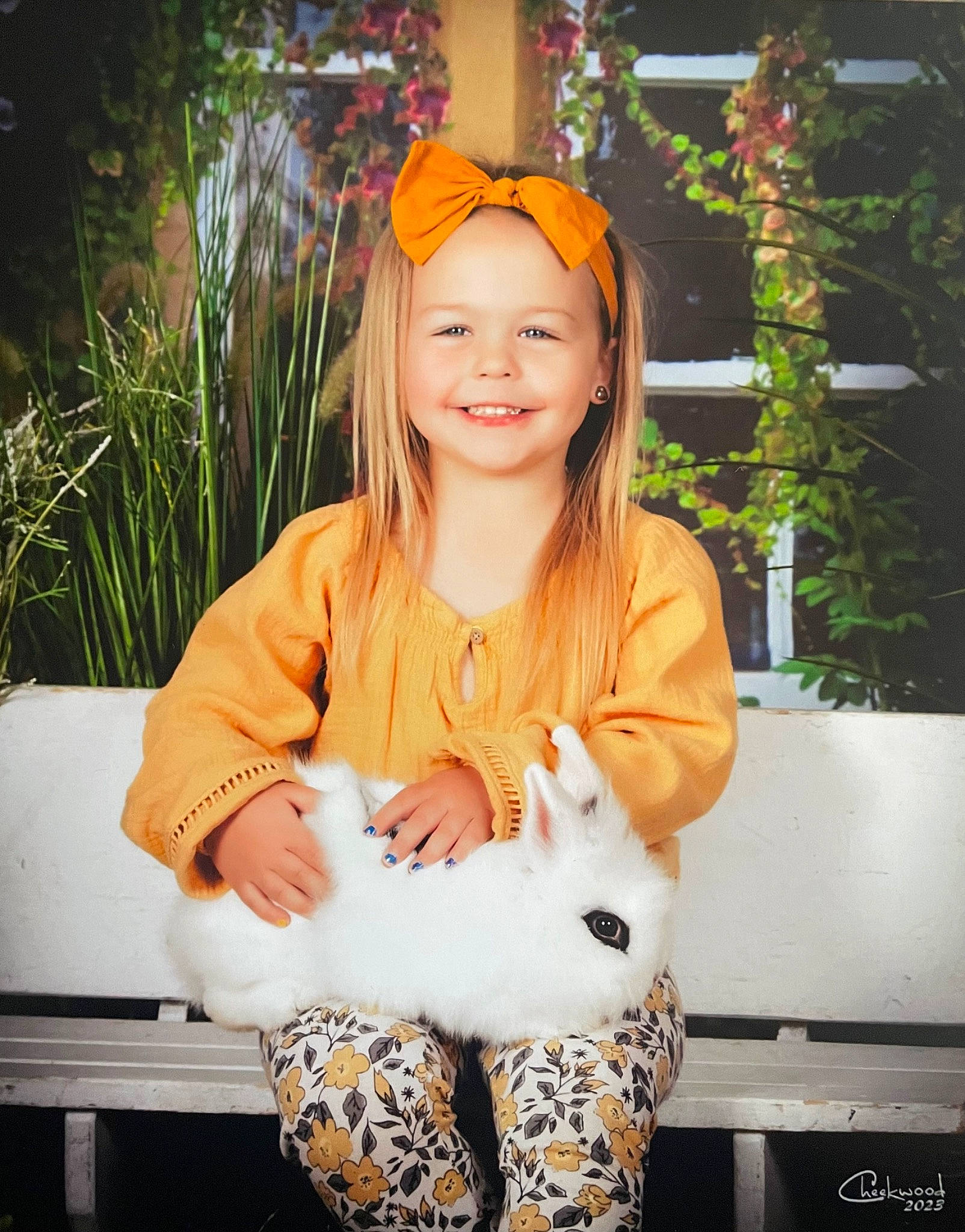 Presleigh is registered to the contest to win money with this photo: chair, child, fawn, fun, fur, grass, happy, head, headwear, human_leg, jewellery, joy, necklace, outerwear, person, plant, sitting, sleeve, smile, t_shirt