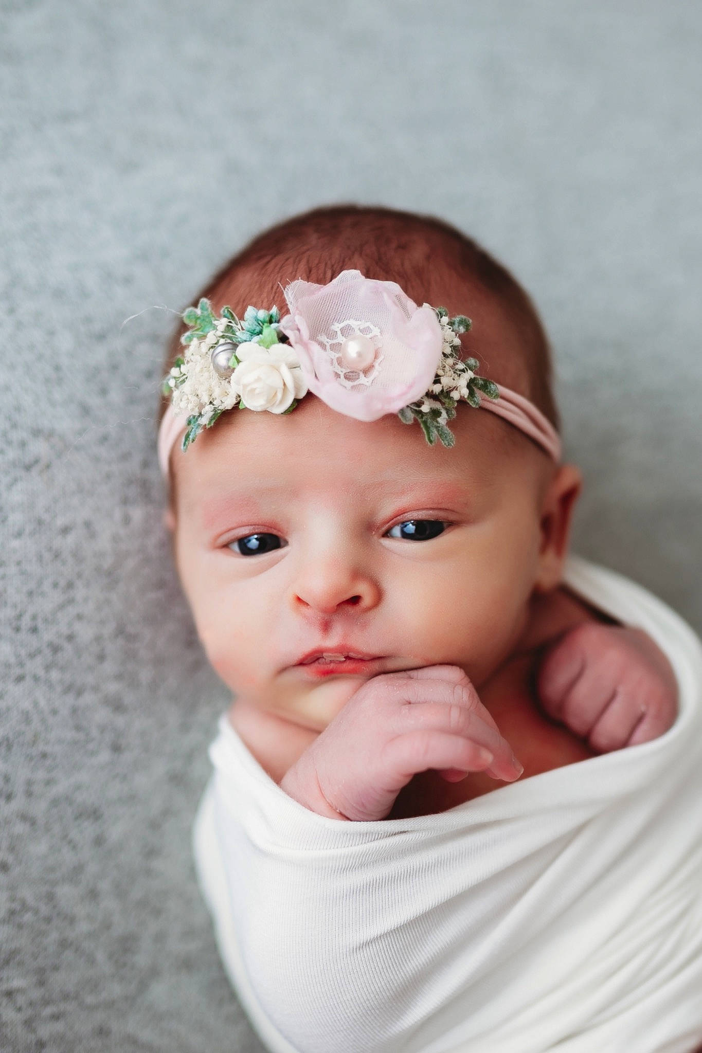 Rosemary is registered to the contest to win money with this photo: art, baby, baby_toddler_clothing, cheek, dress, embellishment, eye, eyelash, flower, hand, head, headband, headgear, headpiece, headwear, iris, lip, person, petal, pink
