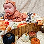 baby, infant, pacifier, headband, basket, blanket, pumpkin, flower, autumn, fall_decor, cozy, cute, portrait, indoors, soft_texture, decorative, child, seasonal, smiling, resting