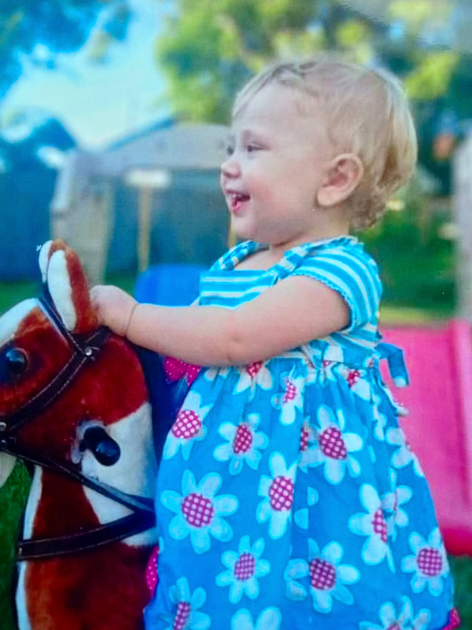 Brooklyn joined the competition — help win amazing prizes! azure, baby_toddler_clothing, blue, bridle, dress, facial_expression, grass, happy, horse, horse_tack, leisure, people_in_nature, person, pink, recreation, shoulder, smile, standing, t_shirt, toddler