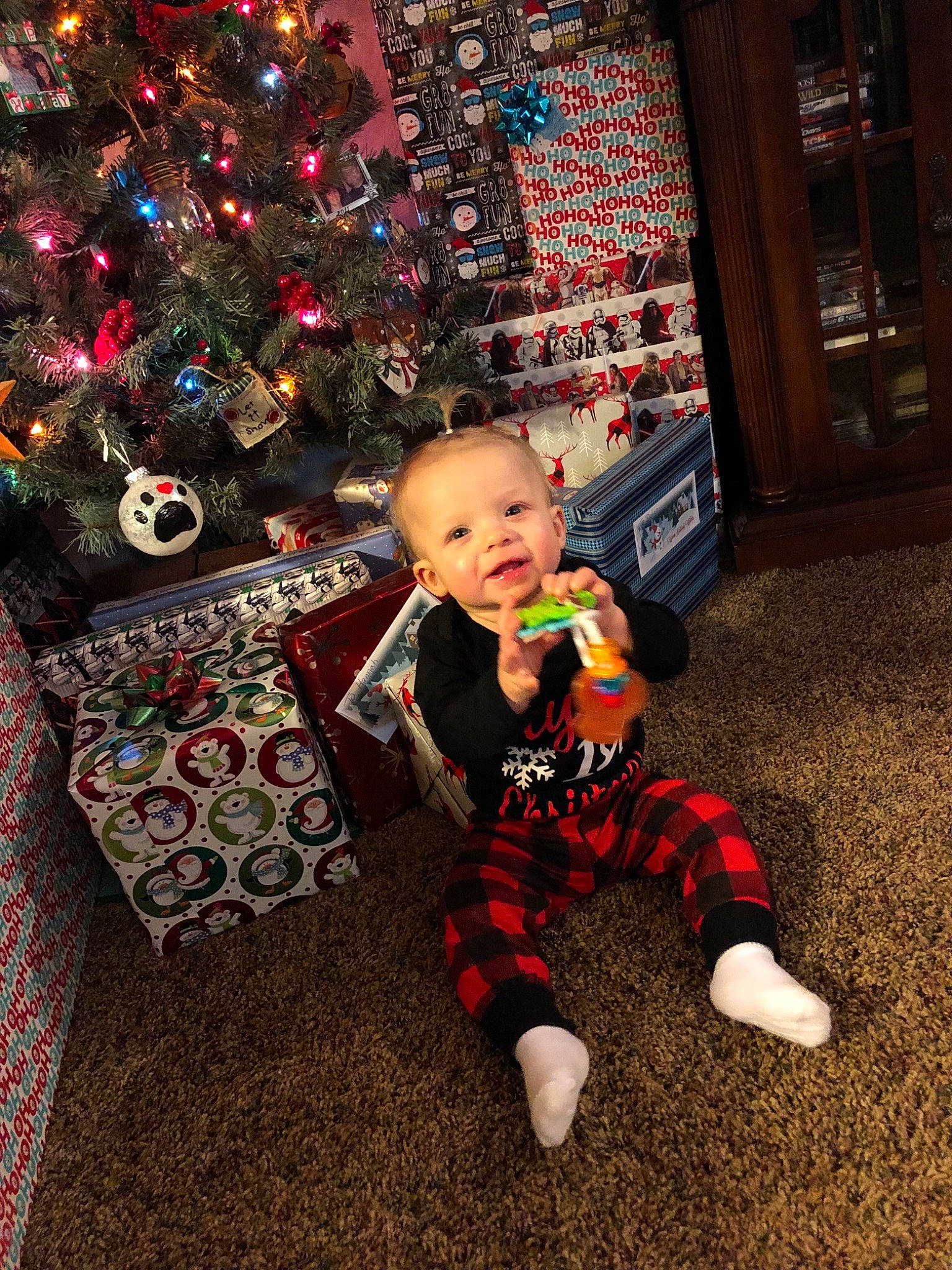 Emelia is registered to the contest to win money with this photo: child, christmas, christmas_decoration, christmas_tree, event, fun, holiday, infant, person, play, toddler, vertebrate