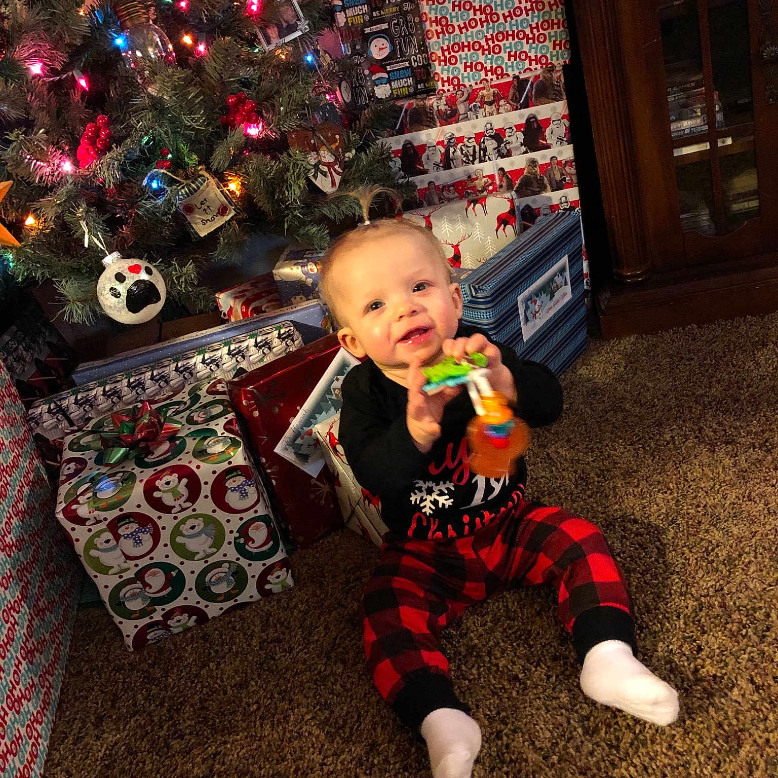 Emelia is registered to the contest to win money with this photo: child, christmas, christmas_decoration, christmas_tree, event, fun, holiday, infant, person, play, toddler, vertebrate