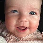 Maggie joined the competition — help win amazing prizes! baby, close_up, smiling, blue_eyes, blanket, pink_clothing, infant, face, cute, happy, child, soft_texture, portrait, young, skin, mouth, tongue, head, cheeks, expression