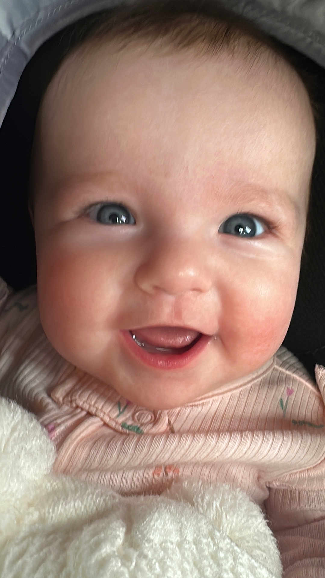 Maggie joined the competition — help win amazing prizes! baby, close_up, smiling, blue_eyes, blanket, pink_clothing, infant, face, cute, happy, child, soft_texture, portrait, young, skin, mouth, tongue, head, cheeks, expression