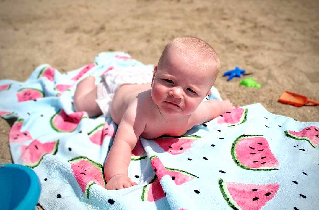 Barrett joined the competition — help win amazing prizes! baby, baby_toddler_clothing, carmine, child, comfort, dress, facial_expression, grass, happy, leisure, linens, pattern, people_in_nature, person, pink, plant, sitting, toddler, tree