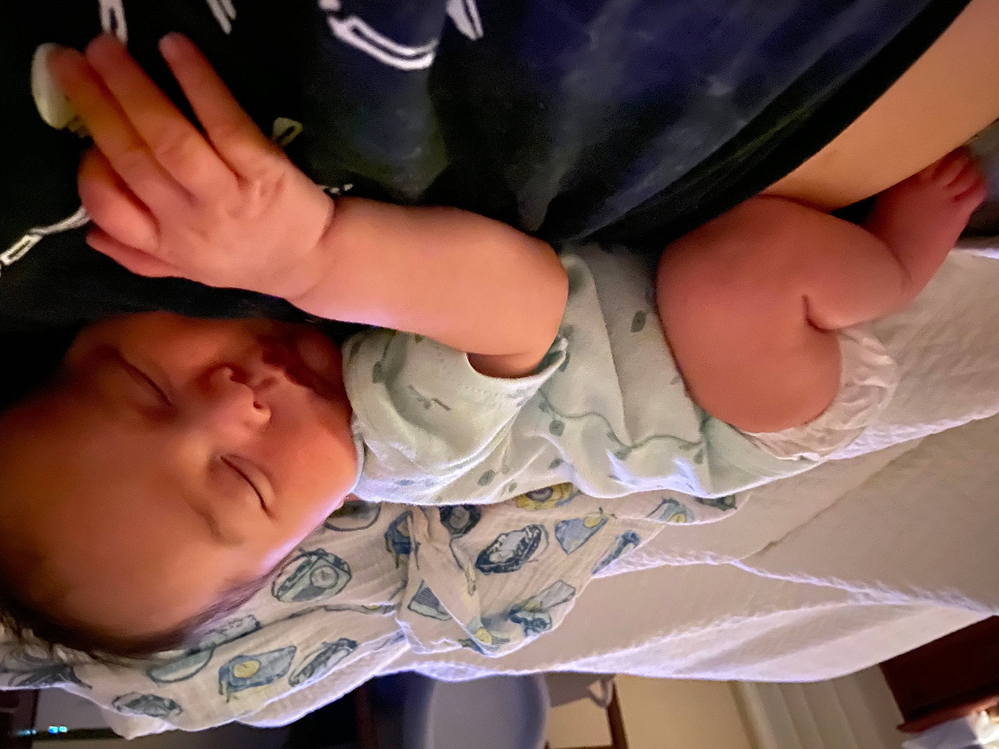 Elvis is registered to the contest to win money with this photo: baby, baby_toddler_clothing, cheek, child, comfort, finger, foot, gesture, hand, human_leg, leg, mouth, nail, person, plant, skin, sleeve, thigh, thumb, toddler