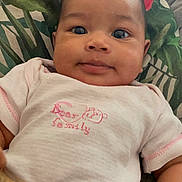 Khelany a rejoint le concours — aidez-le/la à gagner de superbes lots ! baby, infant, child, face, eyes, clothing, shirt, pants, cushion, leaf_pattern, tropical, smile, skin, head, hand, indoor, portrait, young, person, cute