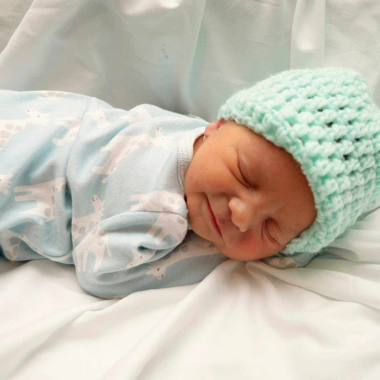 Elijah joined the competition — help win amazing prizes! baby, blanket, child, closeup, clothing, cozy, cute, giraffe_pattern, hat, indoors, infant, knit_hat, newborn, onesie, peaceful, portrait, resting, sleeping, soft, toddler