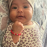 Celeste joined the competition — help win amazing prizes! baby, blanket, bow, bracelet, child, cozy, cute, eyes, face, fashion, headwrap, indoor, infant, leopard_print, lying_down, onesie, photography, portrait, smiling, textile