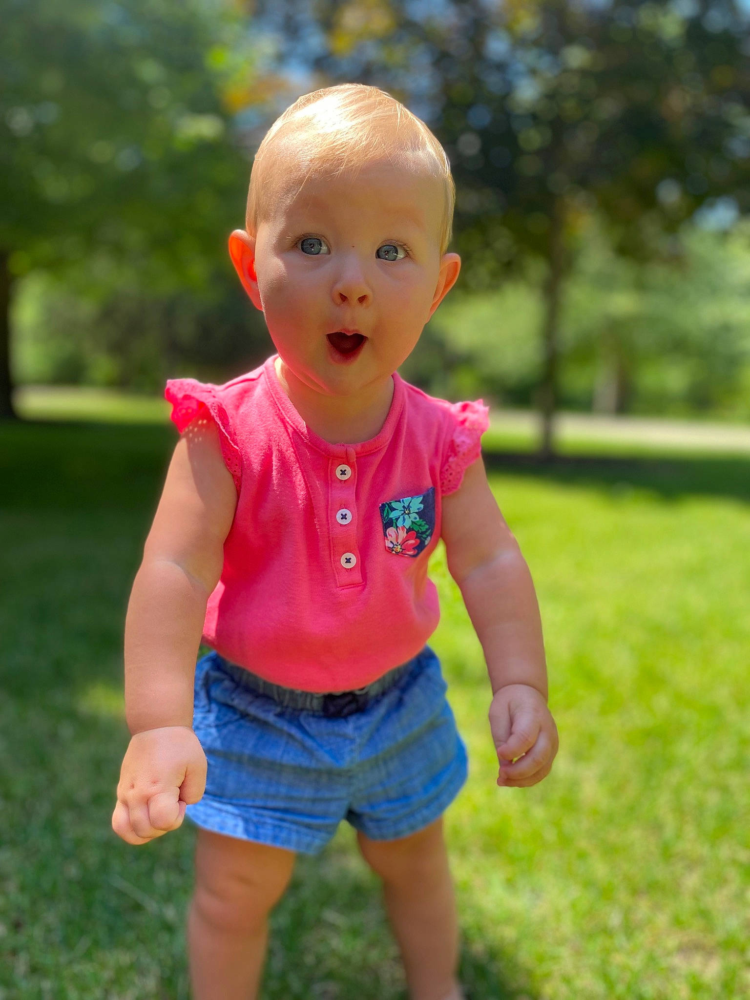 Isla is registered to the contest to win money with this photo: baby, baby_toddler_clothing, electric_blue, eye, grass, happy, leisure, magenta, meadow, people_in_nature, person, pink, recreation, shorts, sleeve, smile, summer, surprise, t_shirt, toddler