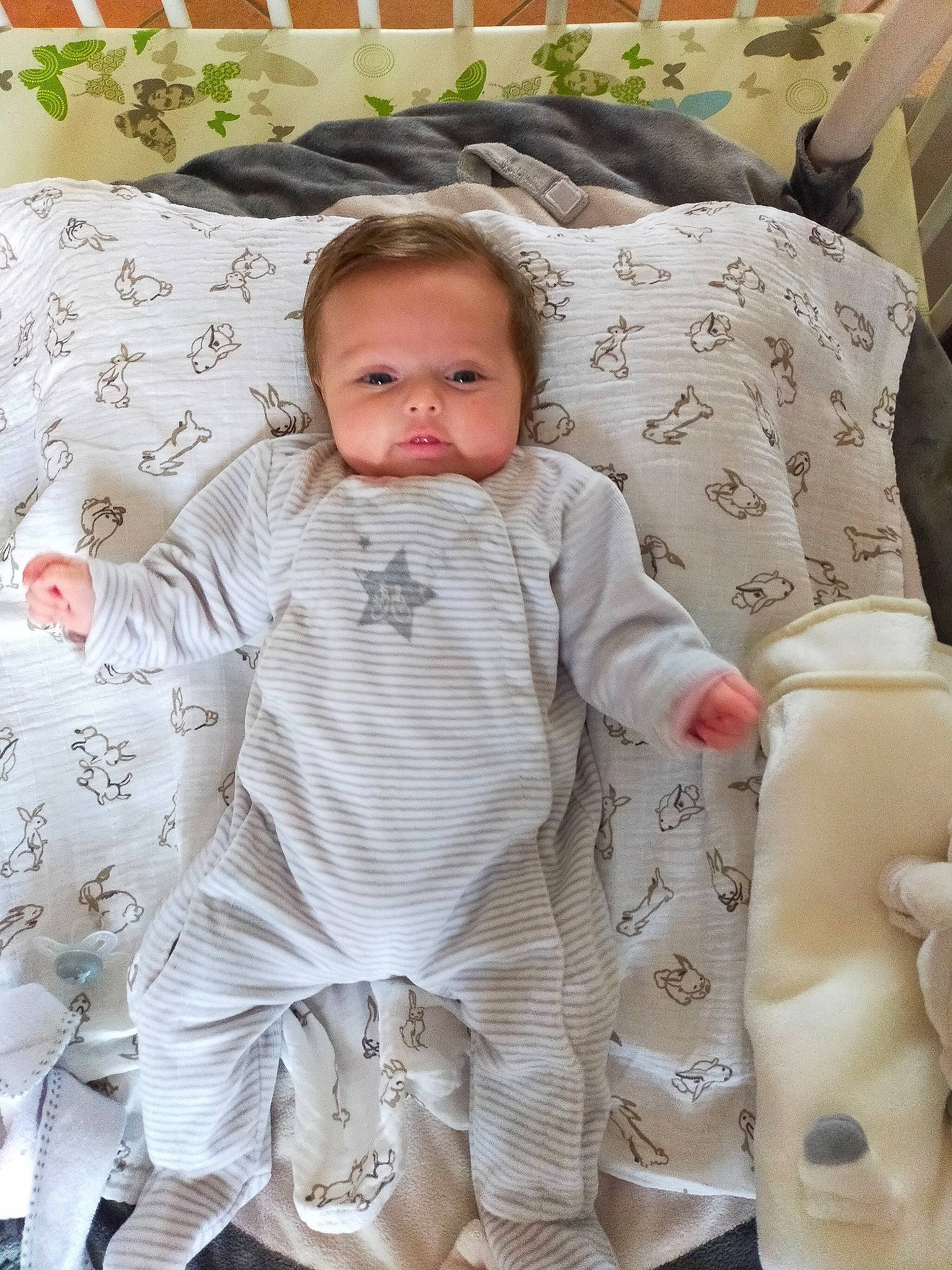 Eden participe au concours pour gagner de l'argent avec cette photo : baby, baby_products, baby_toddler_clothing, bedding, cheek, child, comfort, face, flooring, head, linens, outerwear, pattern, people, person, product, room, skin, sleeve, textile