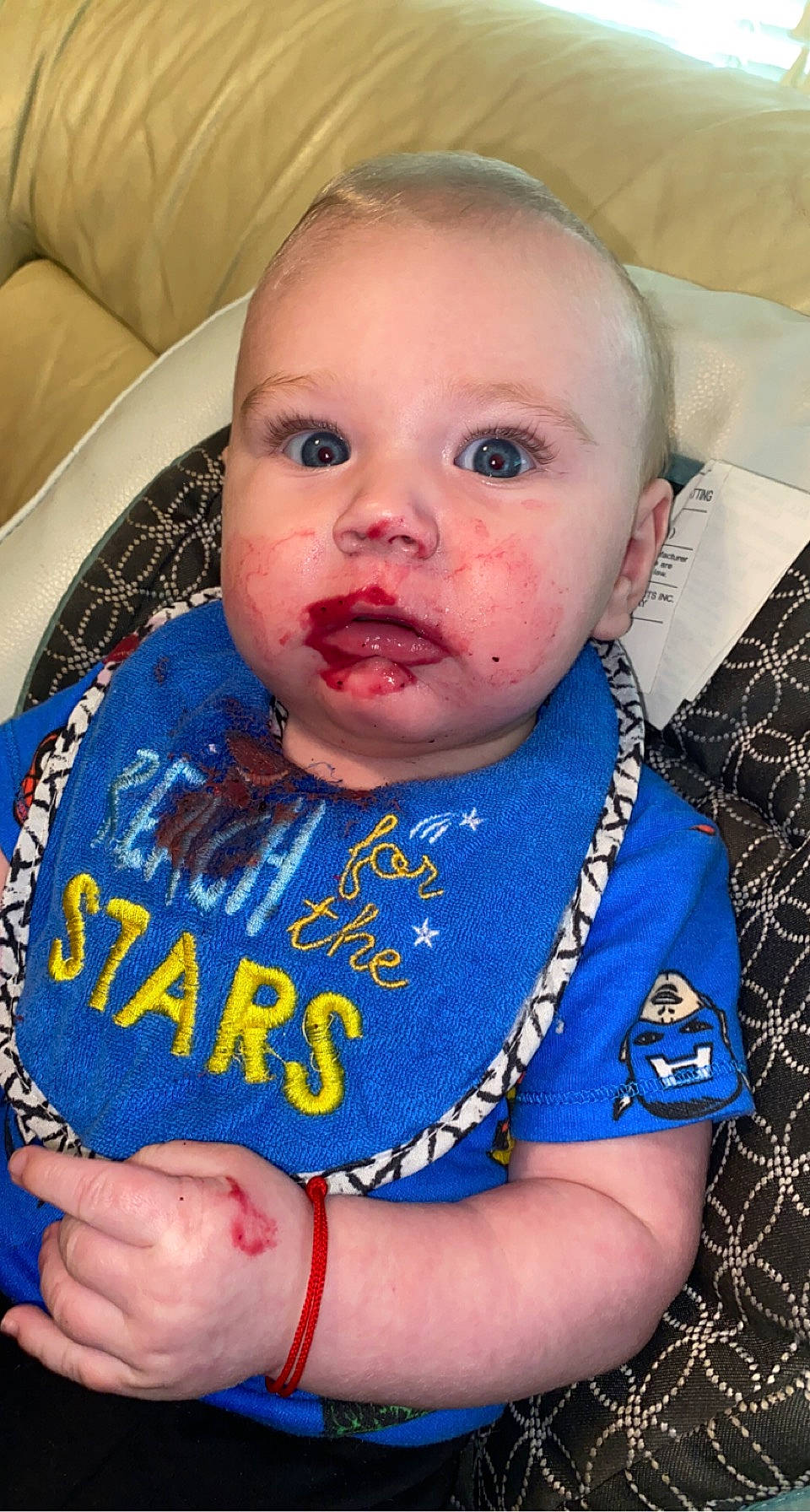 Mayze is registered to the contest to win money with this photo: baby, baby_products, baby_toddler_clothing, cheek, child, electric_blue, eye, eyelash, finger, fun, happy, iris, lip, mouth, neck, nose, person, sitting, sleeve, t_shirt