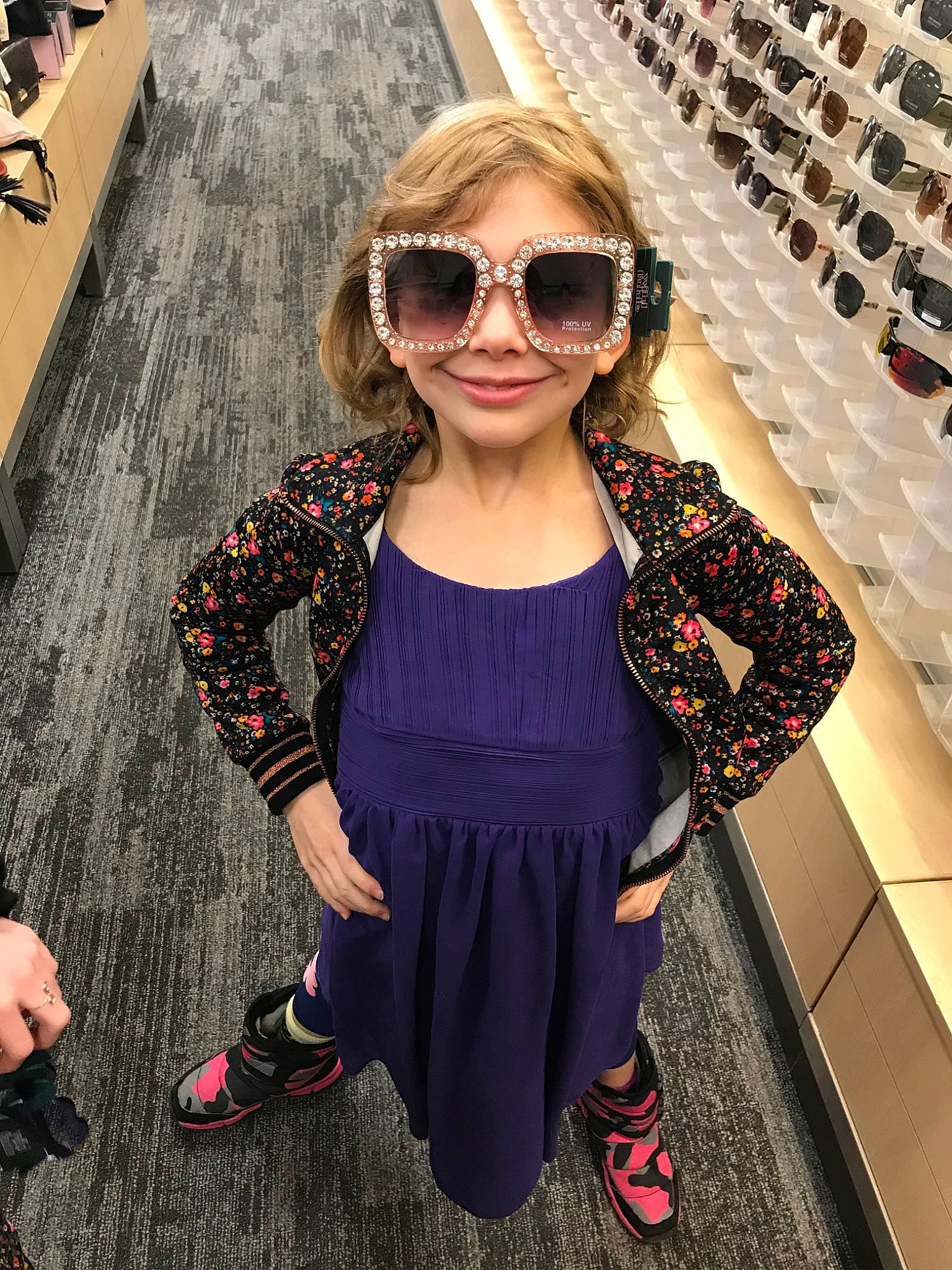 Juliet is registered to the contest to win money with this photo: bangs, child, clothing, cool, dress, eyewear, fashion, fashion_accessory, fashion_design, footwear, glasses, joy, outerwear, person, purple, shoe, shoulder, sleeve, street_fashion, sunglasses