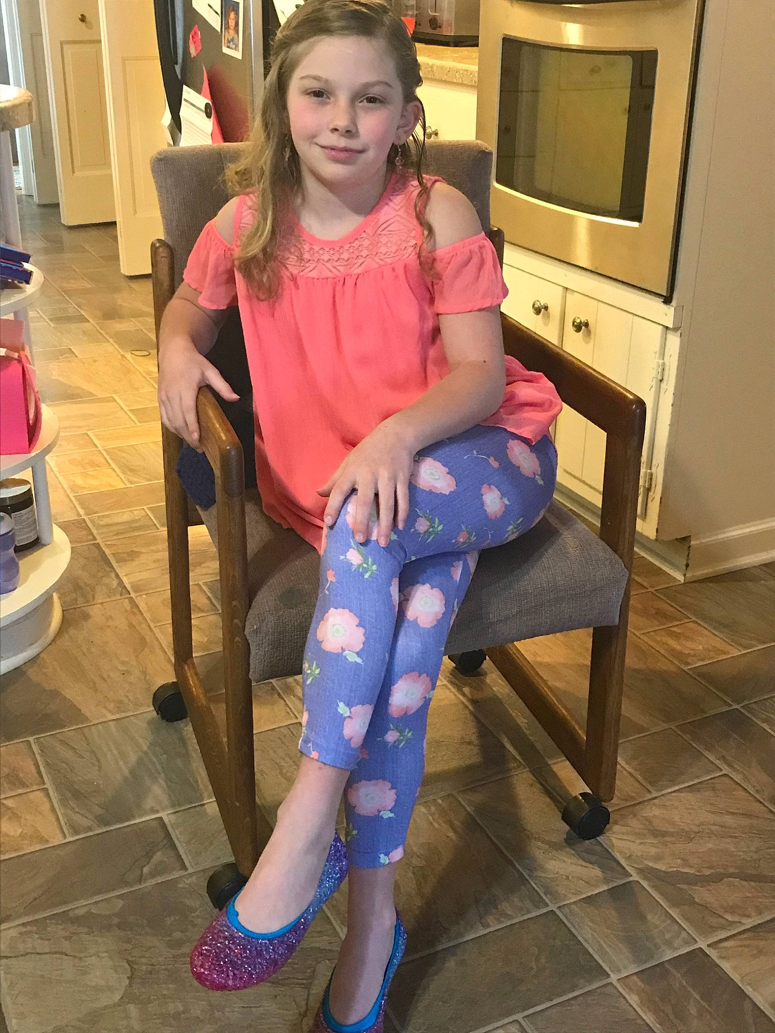 Genevieve is registered to the contest to win money with this photo: chair, clothing, fashion_accessory, furniture, human_leg, joy, leg, leggings, long_hair, person, pink, shoe, shoulder, sitting, thigh, tights