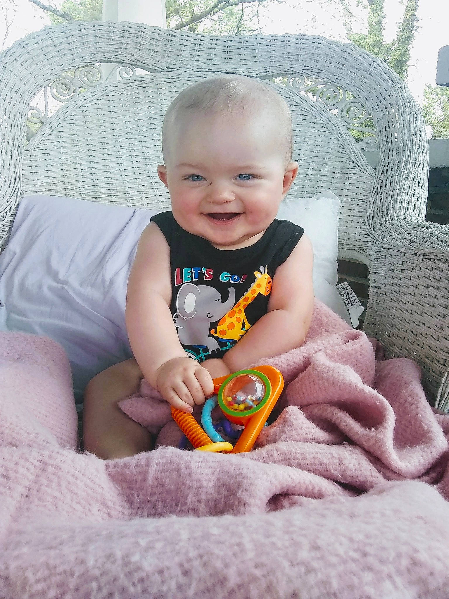 Sylis is registered to the contest to win money with this photo: baby, blanket, child, electronic_device, eye, family, hand, joy, linens, people, person, play, sitting, skin, smile, toddler, toy, vacation, yellow