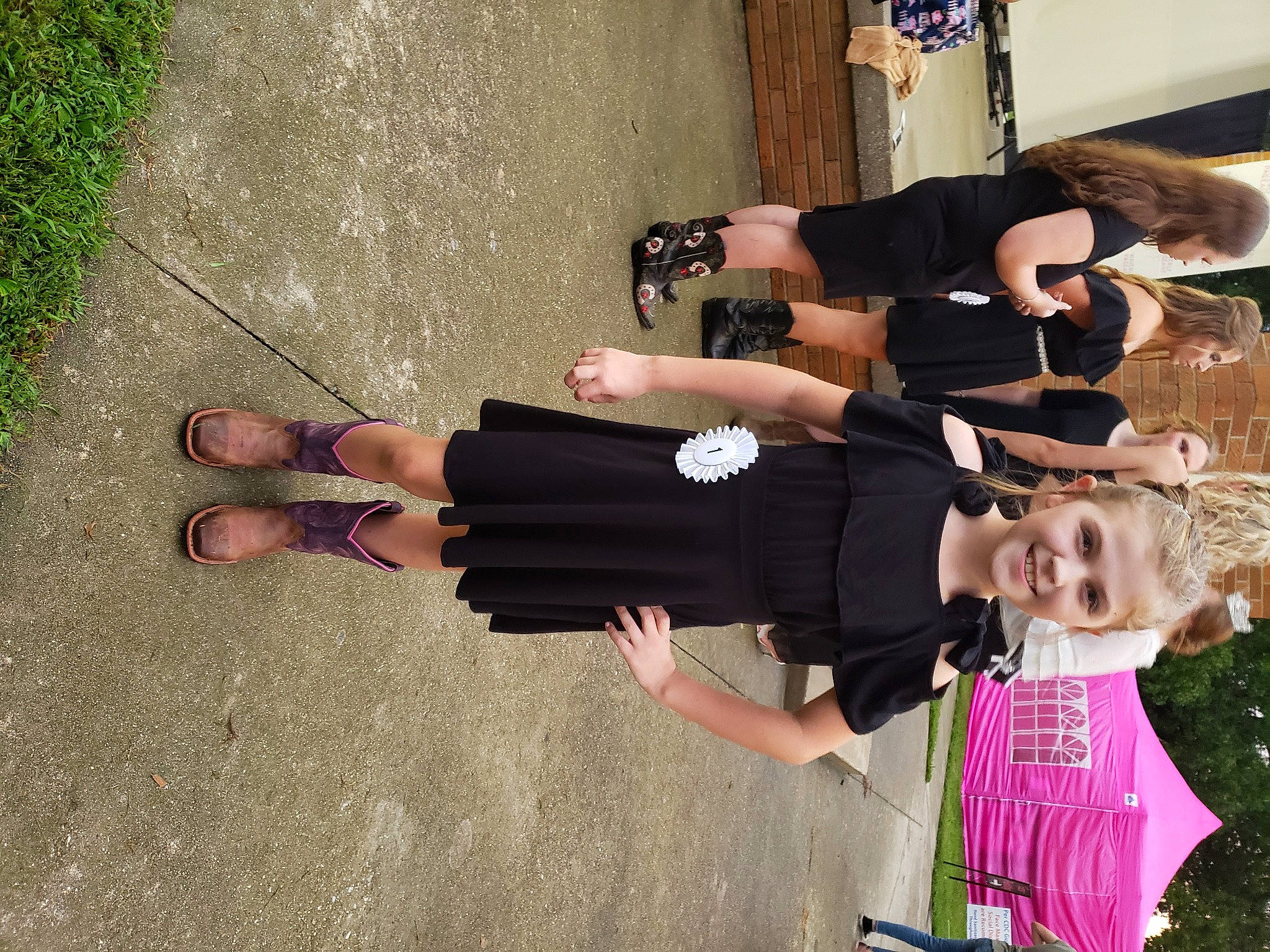 Lynnleigh is registered to the contest to win money with this photo: arm, asphalt, event, finger, foot, fun, gesture, hand, happy, human_leg, joint, joy, knee, person, sandal, smile, street_fashion, thigh, thumb, waist