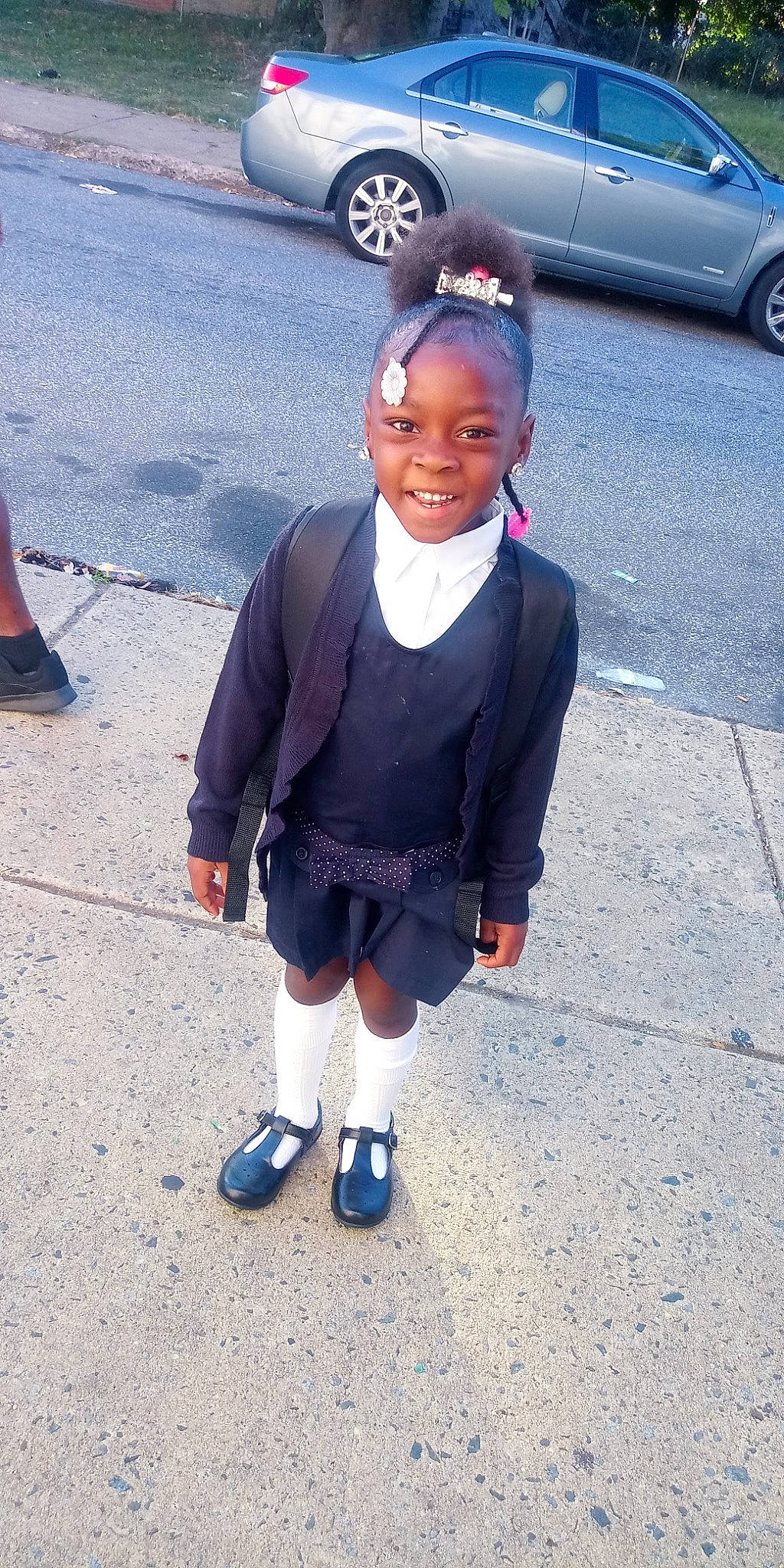 Julie joined the competition — help win amazing prizes! asphalt, automotive_tire, black, car, electric_blue, eyewear, joy, knee, motor_vehicle, pedestrian, person, road, road_surface, shoe, sidewalk, sleeve, smile, sock, street_fashion, tire