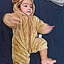 Shahzain joined the competition — help win amazing prizes! baby, child, onesie, bear_costume, fuzzy, cute, infant, motion_blur, arms, leg, pacifier, toy, blanket, soft, indoor, portrait, expression, cuteness, hood, zipped