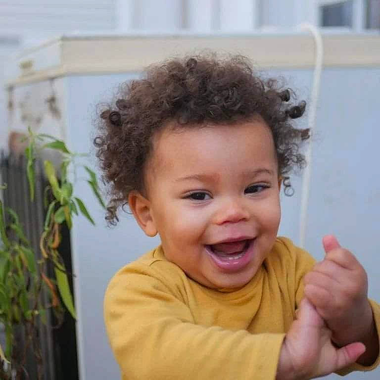 Isaac participe au concours pour gagner de l'argent avec cette photo : baby_toddler_clothing, cheek, chin, eye, eyelash, face, flowerpot, fun, gesture, happy, houseplant, lip, mouth, nose, person, plant, skin, sleeve, smile, thumb